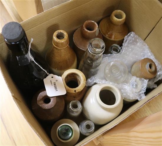 A collection of advertising bottles, including three aqua glass codd examples,